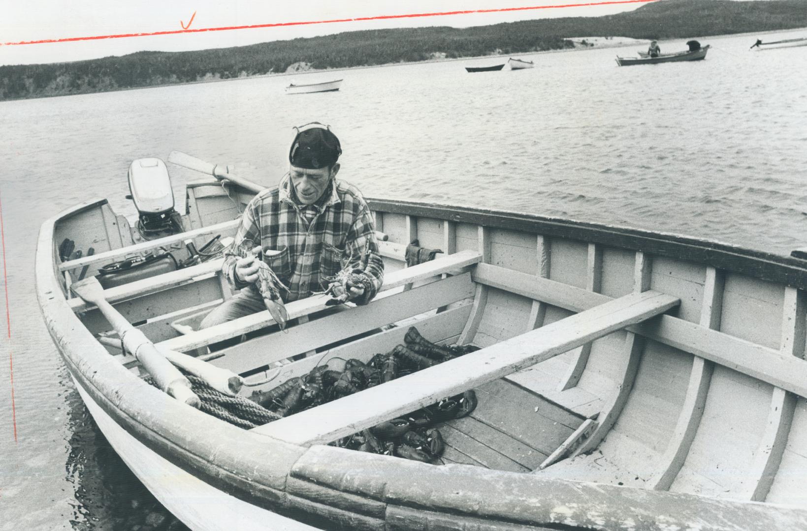 At come-by-chance, a Newfoundland outport, lobsterman Jim Pevie goes about his work in much the same fashion as men of the area have done for more tha(...)