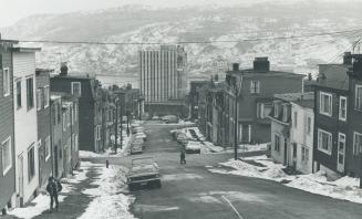 St John's NFLD, New Royal Trust Bld at bottom of street of old houses, Harbour in background