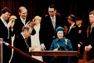 Historic Moment: Then Prime Minister Pierre Trudeau and the Queen sign the 1982 Charter of Rights, which did not contain property rights provisions