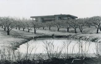 An apple orchard, maintained and picked by a commercial operator, surrounds the CUNA Mutual Insurance Society building on the North Service Rd. beside(...)