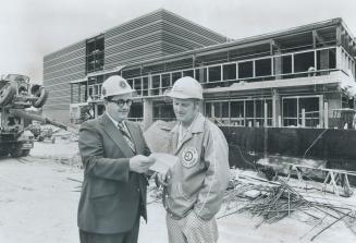 The $6.1 million sports centre under construction in Centennial Park is nearing completion and Etobicoke Mayor Dennis Flynn visited the site yesterday(...)