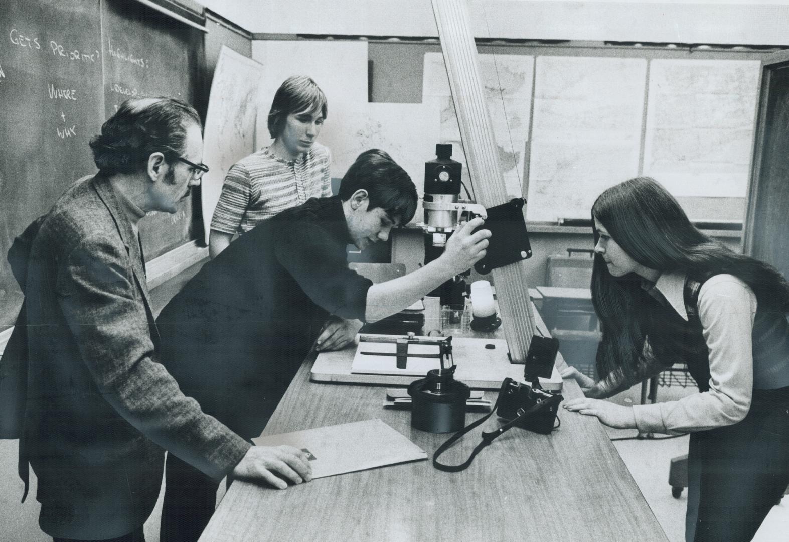 Escaping from schoolwork, these students learn something about photography during Alderwood Collegiate's Activities Day program yesterday. The Etobico(...)