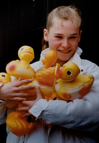 Life's just ducky for Stacey, Stacey Galloway, 14, gets into the spirit of things for the Kiwanis Credit River Duck Race, Saturday from Norval to Bram(...)
