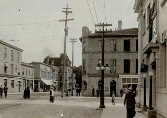 (2) Corner of main st. and water st., much busier now. [Incomplete]