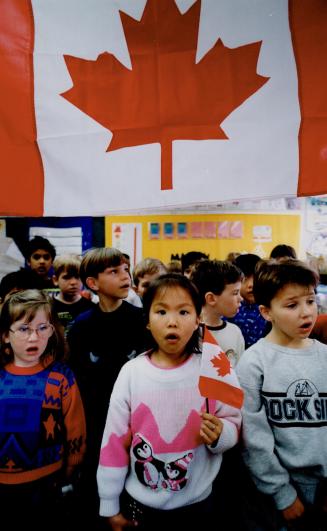 Good morning, Canada: Grade 1 pupils at Plumtree Park Public School sing the national anthem before class