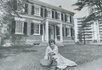Mrs. Louise campbell sits on the lawn of Gibson House, one of North York's historical buildings, which will be opened as a borough museum Sunday. The (...)