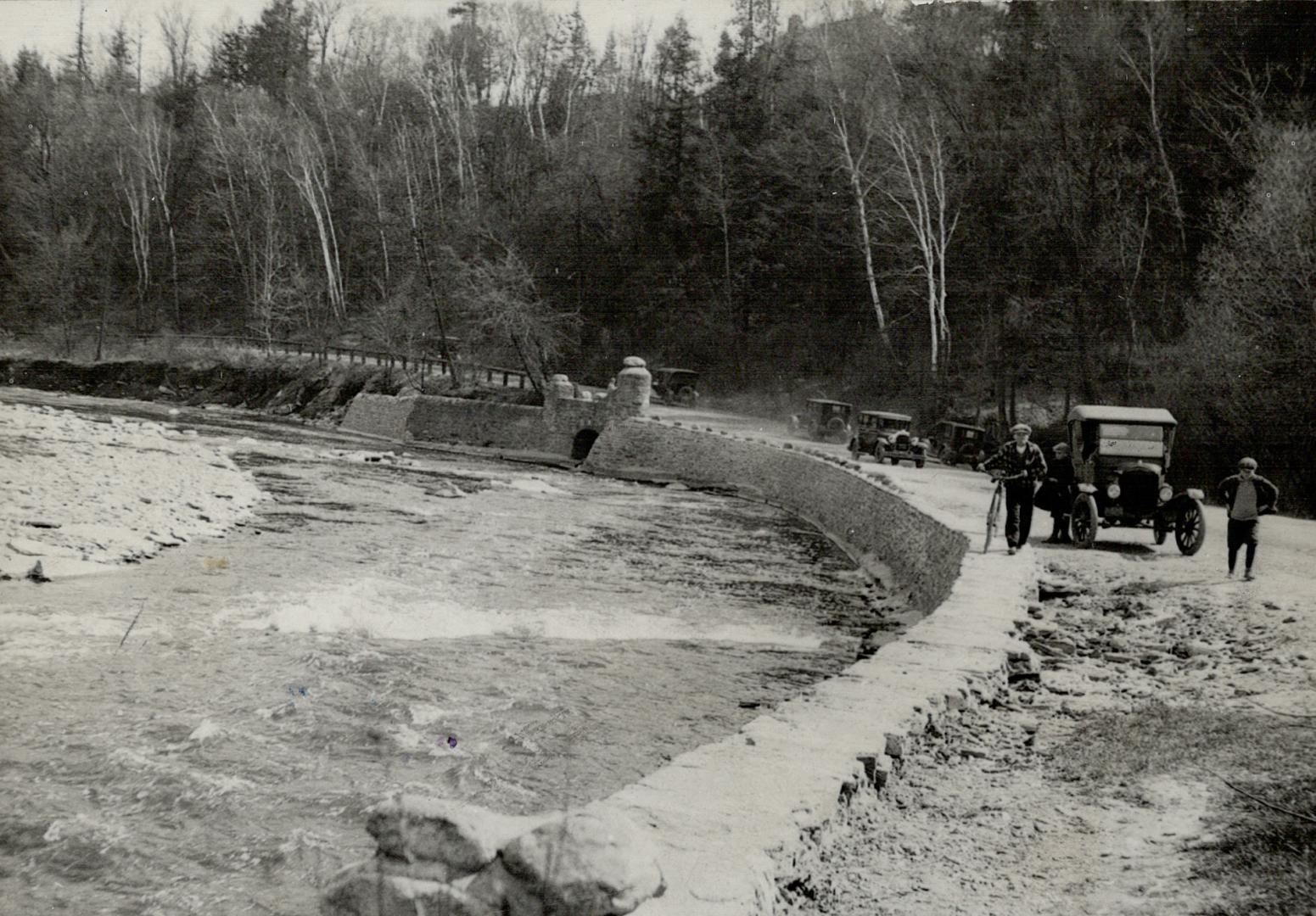 A stone wall along the drive between Bloor street and Lambton intended to keep the Humber river within bounds while on its spring rampage