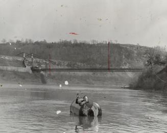Duplicating the trip from Niagara Falls to Queenston of the late Red Hill, famous Niagara riverman, his son, William Red, Jr., plans to make the dangerous trip July 4