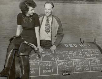 This is the barrel in which Red, here with an interested visitor, plans to make the hazardous journey
