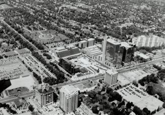 Aerial shows North York's 'Downtown spire with triangular top is Mel's Bells, overlooking Mel Lastman Square