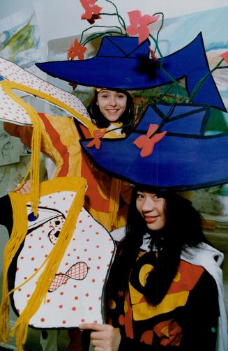 Art alive and well at Claude Watson, Larissa Moore (top) and Toni Brem, grade 8 students at Claude Watson School for the Arts, wear wild hats inspired by a Roy Lichtenstein painting