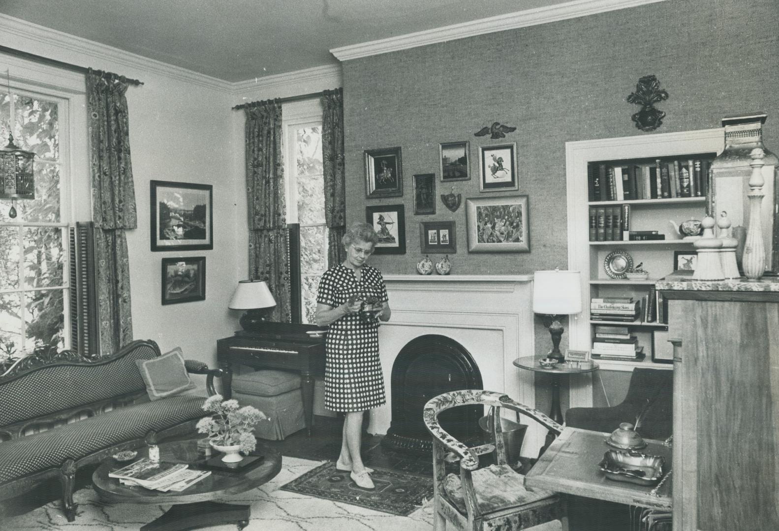Mrs. Wilder breckenridge stands in front of the fireplace in Cantley House, built as a cottage in 1838 and enlarged to two storeys in the 1850s. It is(...)