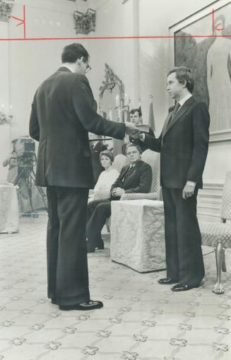 Moment of power for Joe Clark, swon in by Privy Council clerk Michael Pitfield