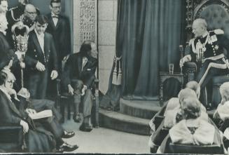 Pulling up his socks during the formal opening of the fourth session of Canada's 28th Parliament yesterday, Prime Minister Pierre Trudeau makes sure h(...)