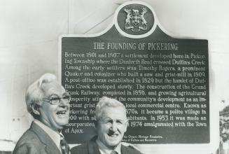 After unveiling historical plaque commemorating founding of Pickering in 1801, (left) and Cyril Morley, former Pickering Village reeve, discuss old ti(...)