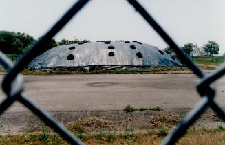 Sewage treatment plant - sharps covering contaminated soil