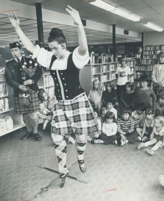 Dancing by the books. A sword dance was performed yesterday in the McGregor Park Public Library by Pamela Chambers, 17, of West Hill, accompanied by p(...)