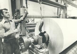 Vic Turgeon, operates lift, moving rolls of paper Abitibi