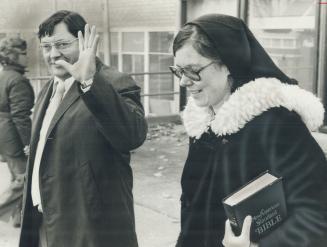 Clutching her Bible, Cheryl Blake attends inquest on her husband, Philip, with Hector Haynes, leader of the religious group