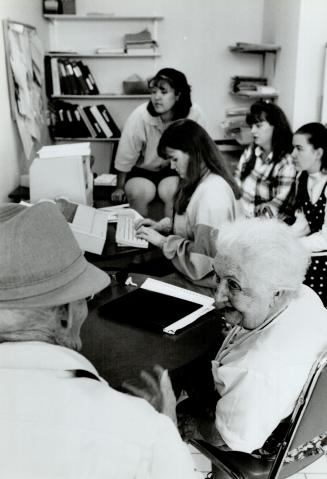 High tech talk: Students from Sir Wilfred Laurier Collegiate help seniors at Livingston Lodge communicate with elementary school students via computer
