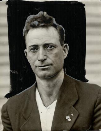 Operator of Standing Derrick. Sam Jones, operator of the derrick which stood the strain of the collapse of the crane on the opposite bank of the Wella(...)