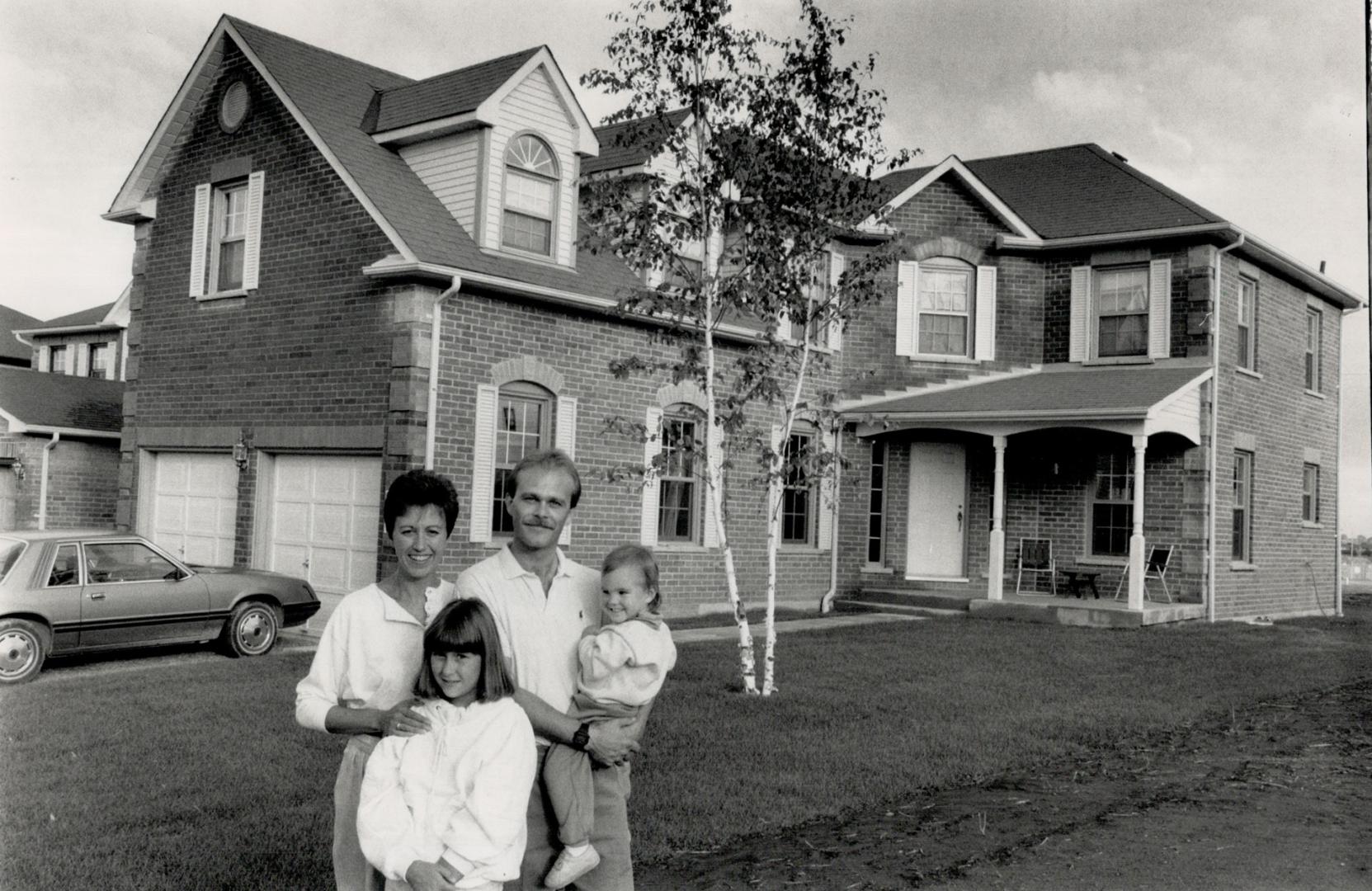 Family home: Paul and Paulette McGill and their children Jennifer, 11, and Lindsay, 2, moved into a new home in Whitby which is nearly twice the size of their previous Scarborough house