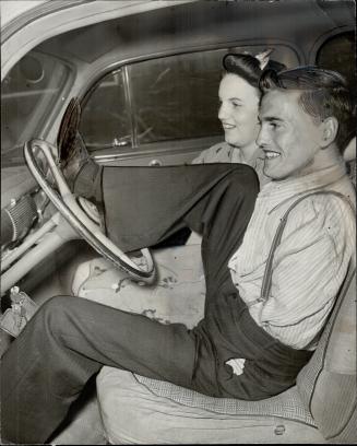 He manages to drive, also, with his feet, as he demonstrates for Alice Farrow