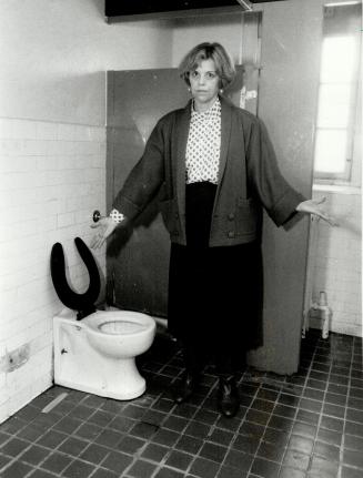 Outmoded buildings: Hazel Pritchard displays the one working toilet that serves up to 20 people in on section of the Whitby psychiatric hospital