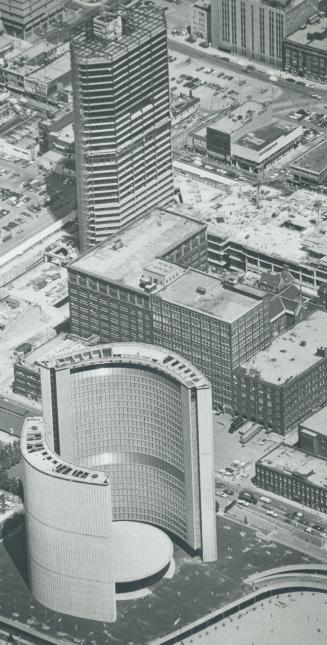 Eaton's centre under construction (Dundas - Yonge) with city hall in foreground