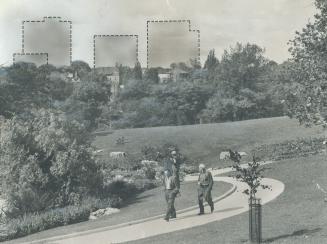 Image shows a few gentlemen walking in the park with contours of the high-rise apartment buildi…