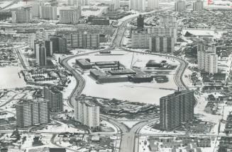 Image shows a view of a development of high-rises and townhouses along Don Mills Road, Toronto, ...