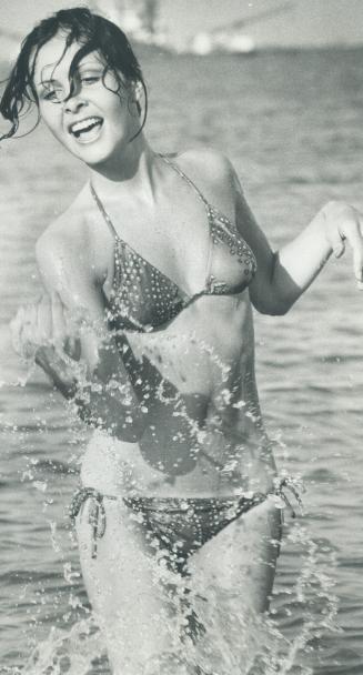 Sharia Varley, model, wearing a string cools off after a dip in Lake Ontario (Cherry Beach)