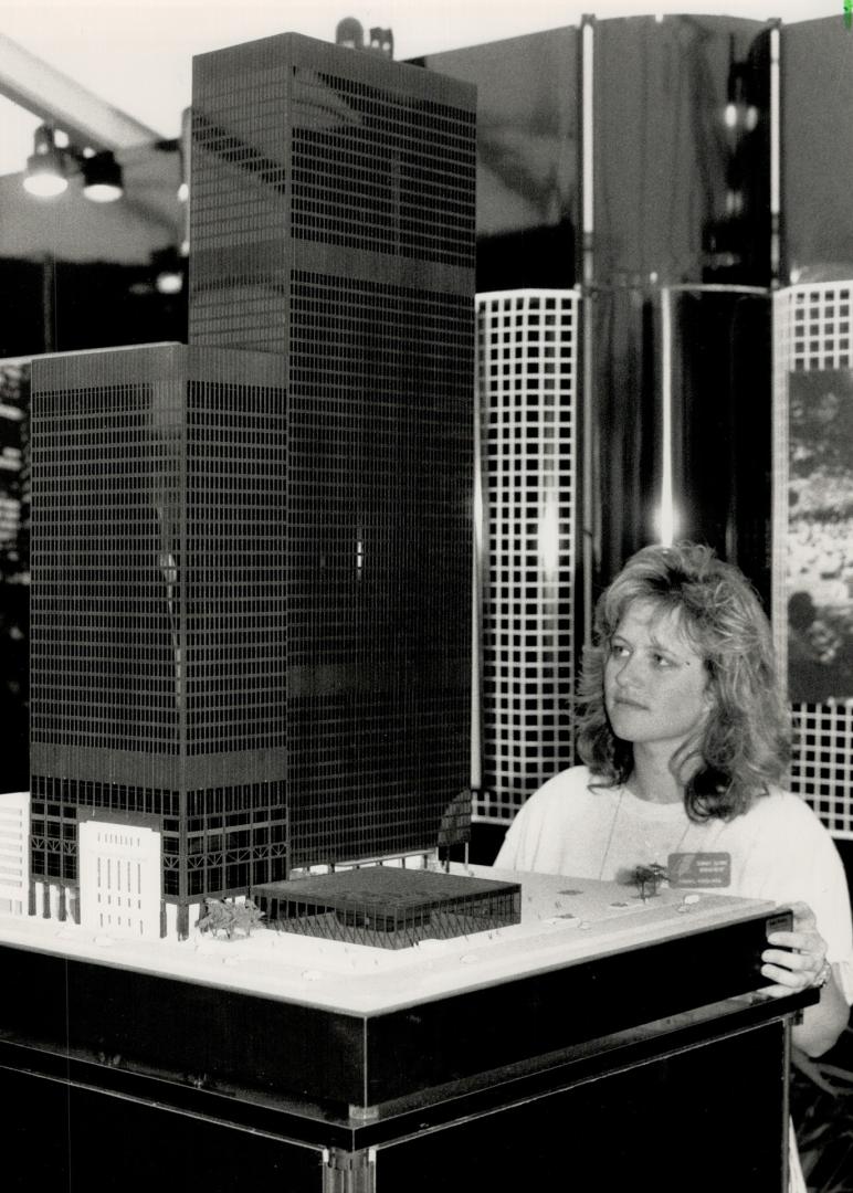 Fifth tower: Cheryl Ferguson, a media consultant with the Summit Square Management office, views architect's model of a proposed fifth tower in Toronto's TD Centre