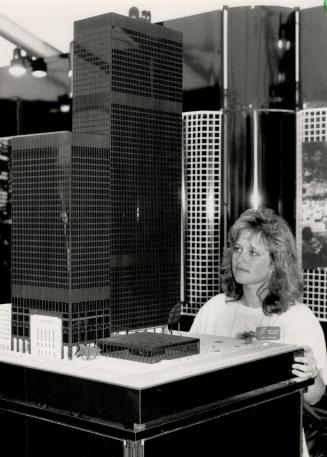 Fifth tower: Cheryl Ferguson, a media consultant with the Summit Square Management office, views architect's model of a proposed fifth tower in Toronto's TD Centre