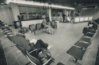 Bus terminal's new face. Passengers find plenty of room to sit while waiting for buses in the main lobby of the terminal at Bay and Dundas Sts. after (...)