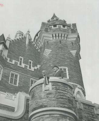 In the turret of the castle, Barney Krivel, left, and Tommy Thompson look out on the grounds of Casa Loma