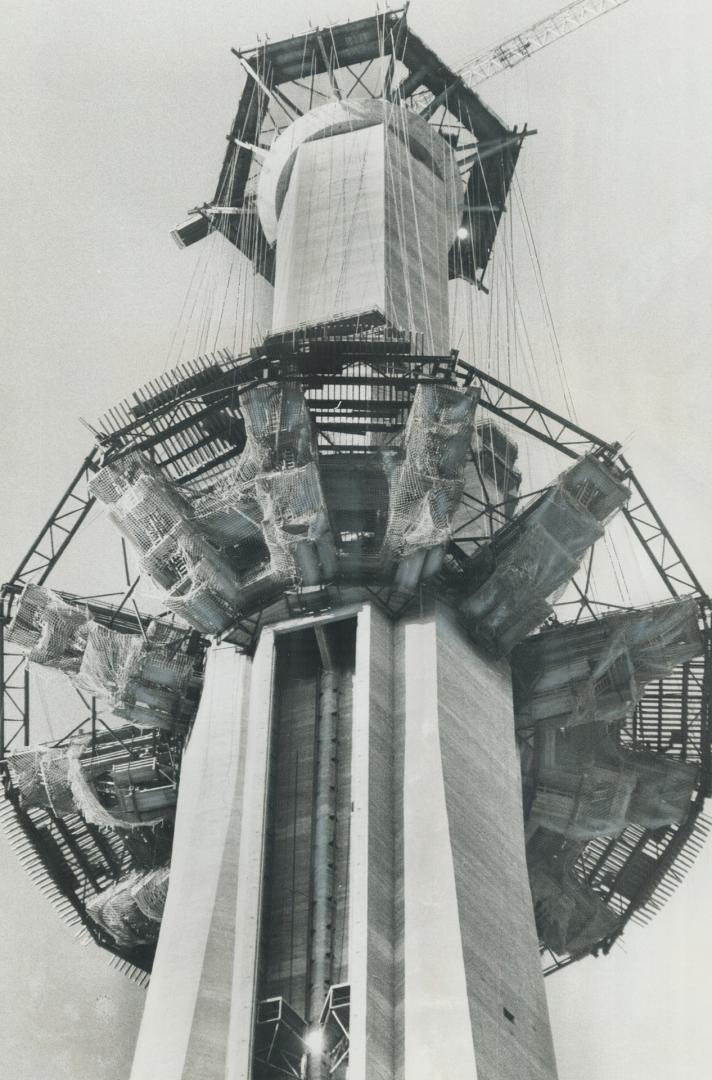 Up goes the CN tower's crown. That crown-like structure that has been inching up the CN Tower is 350 tons of pod structure that will be the forms of t(...)