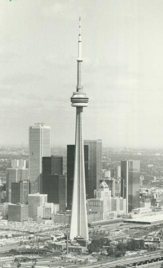 Tumbling down the tower. Stuntman Roger Brown, padded everywhere except on his head, rolls down the CN Tower's 1,760 steels steps today to try to rais(...)