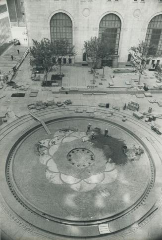 Patterned circle is the base of fountain in one-acre interior plaza of new downtown Commerce Court