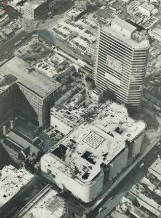 While T. Eaton co. makes plans to shut down its catalogue operation. the company is moving rapidly St. This aerial view shows, at upper right Number O(...)