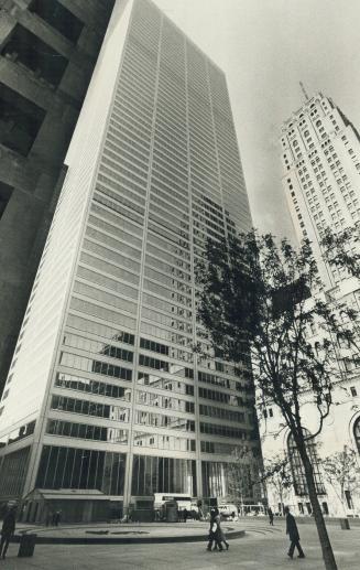 Towering overhead, the 57-storey Commerce Court West building dwarfs passersby