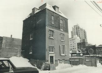 Scadding house sits amidst the rubble of demolished buildings on site of Eaton Centre project at Trinity Square