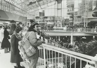 The new Eaton Centre. Well composed picture with young person on left hand side gazing down on the action