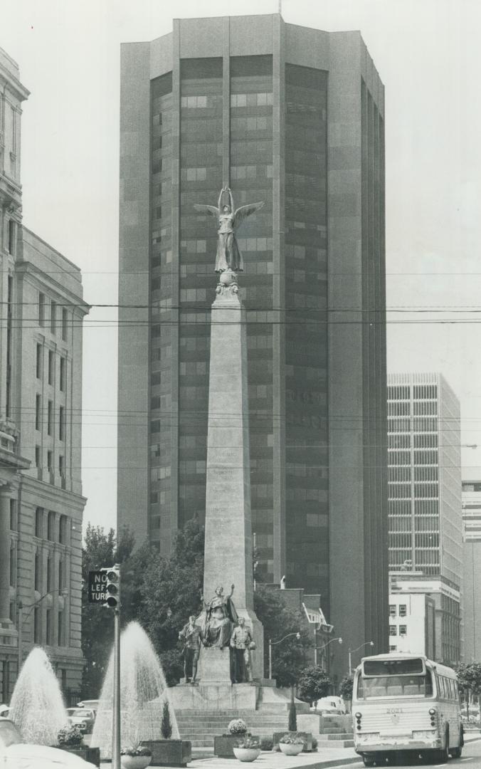 Insurance - and a winged lady. Three insurance buildings are caught in this view of University Ave. Centre, as a backdrop for the Sough African war me(...)