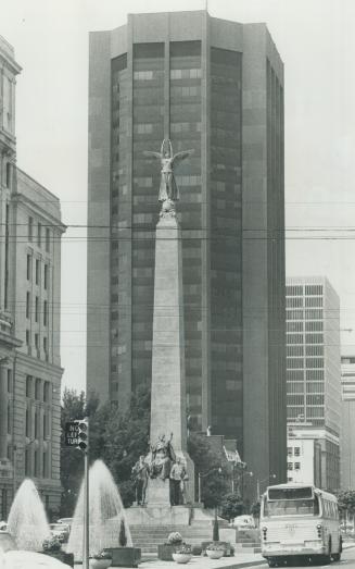 Insurance - and a winged lady. Three insurance buildings are caught in this view of University Ave. Centre, as a backdrop for the Sough African war me(...)