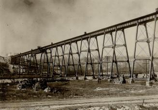 Image shows a CP rail bridge over the river.