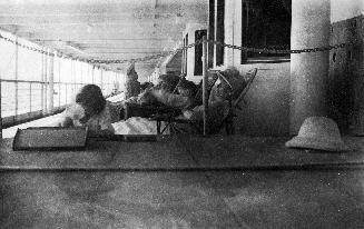 Arthur Conan Doyle and family in deck chairs aboard the Naldera, 1920