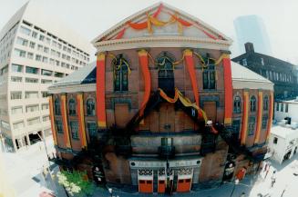Historic photo from Friday, June 10, 1994 - Massey Hall - fish-eye lens, all decked out in ribbons for its 100th anniversary in Garden District