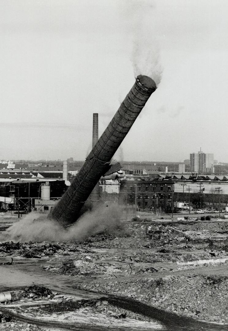 Smokestack at the old Goodyear plant hits the ground to make way for Lakeshore Village