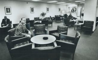 In the Lavish MPP's Lounge at Queen's Park, Mac Makarchuk (foreground) of NDP couldn't order liquor from the two uniformed stewards, even if he wished(...)